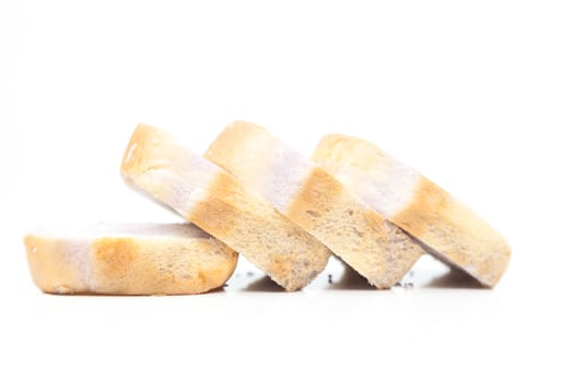 Sliced bread. Rectangular plate is divided into pieces. Isolated white background