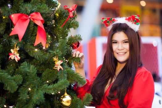 Happy and smile santa woman.relax and smile in christmas day.standing near tree chirstmas and gift.