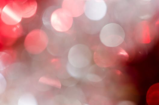 Abstract red silver circle christmas lights as background.