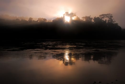 Scenic sunrise above lake in bolivian Andes