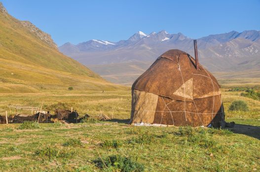 Traditional yurt on green grasslands in Kyrgyzstan