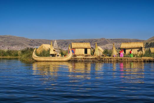 Traditional village on floating islands on lake Titicaca in Peru, South America    