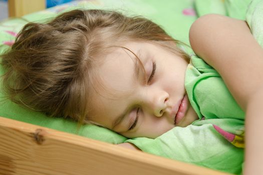 six year old girl Europeans sleeping in her bed