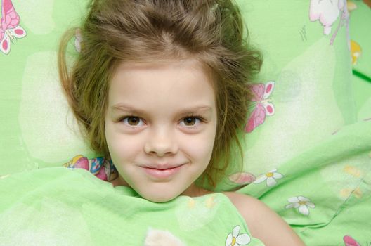 Six year old girl woke up in the morning in her crib