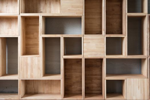 Empty wooden boxes on the ground in a room.