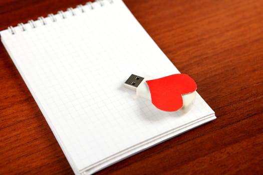 USB Flash Drives with Heart Shape on the Blank Note Pad