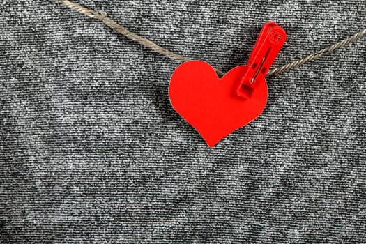 Red Heart Shape on the Rope on the Textile Background