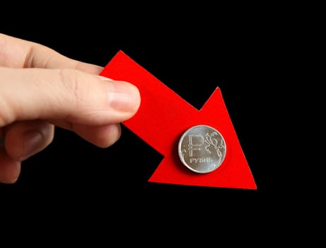 Red Arrow in a Hand with Russian Ruble Down on the Black Background