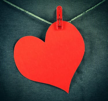 Red Heart Shape on the Rope on the Textile Background