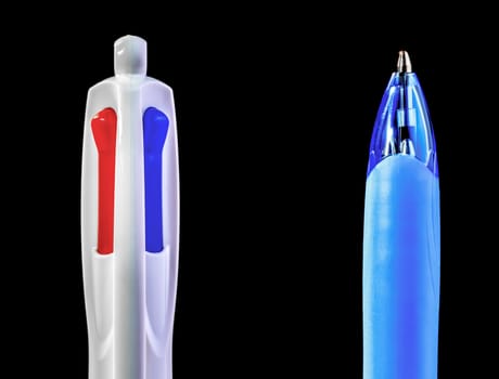 The top and the bottom of a multi colour pen, revealing the colors, red, white, and blue.