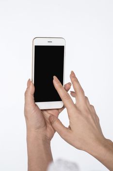 Female hands using mobile phone with black screen