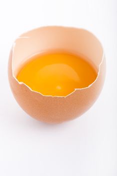 Raw egg close-up on white