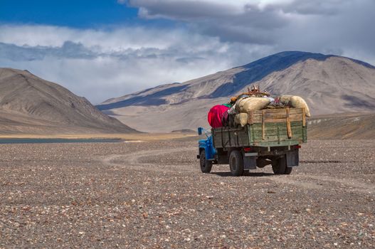 Truck loaded with goods on the road in Pamir mountains in Tajikistan