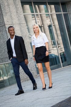 young successful business man and woman outdoor summer smiling