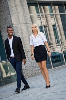 young successful business man and woman outdoor summer smiling