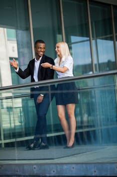 young successful business man and woman outdoor summer smiling