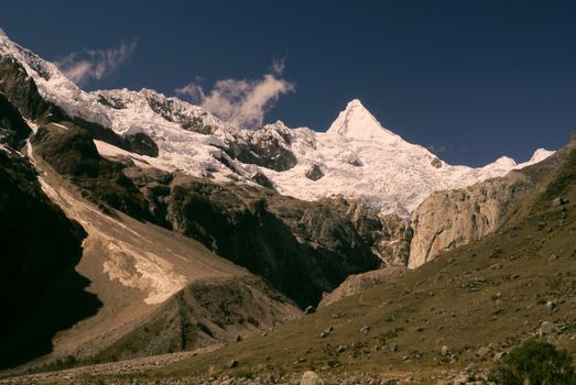 Picturesque valley below Alpamayo, one of highest mountain peaks in Peruvian Andes, Cordillera Blanca