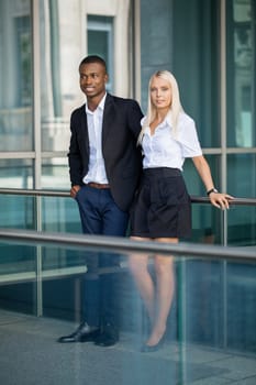 young successful business man and woman outdoor summer smiling