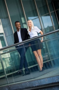 young successful business man and woman outdoor summer smiling