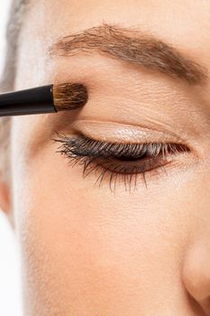 attractive woman in beauty salon make up brown eyeshadow professional 