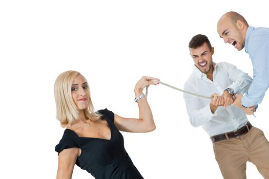 Beautiful strong fit woman demonstrating her dominance in a tug of war with two men pulling as hard as they can on the end of a rope she is holding while she remains nonchalant and glamorous, on white