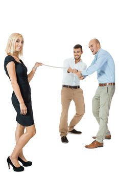 Beautiful strong fit woman demonstrating her dominance in a tug of war with two men pulling as hard as they can on the end of a rope she is holding while she remains nonchalant and glamorous, on white