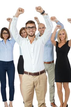 Successful business team of diverse young executives standing cheering and celebrating their success with an attractive young businesswoman or team leader in the foreground, on white