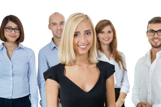 Successful business team of diverse young executives standing cheering and celebrating their success with an attractive young businesswoman or team leader in the foreground, on white