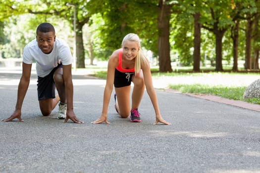 young couple runner jogger in park outdoor summer sport lifestyle 