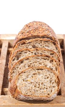 Sliced Whole Grain Bread on Wooden Cutting Board over white background