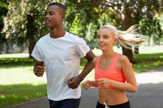 young couple runner jogger in park outdoor summer sport lifestyle 