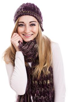 Beautiful female model with long blond hair smiling wearing beanie and scarf on white background