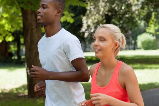 young couple runner jogger in park outdoor summer sport lifestyle 