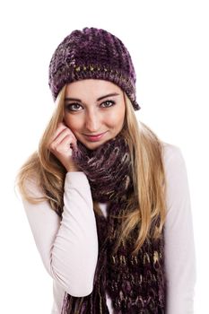 Beautiful female model with long blond hair smiling wearing beanie and scarf on white background