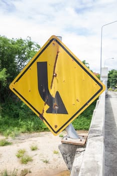 broken and old road sign on the bridge in thailand