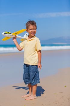 Beach kid boy kite flying outdoor coast ocean