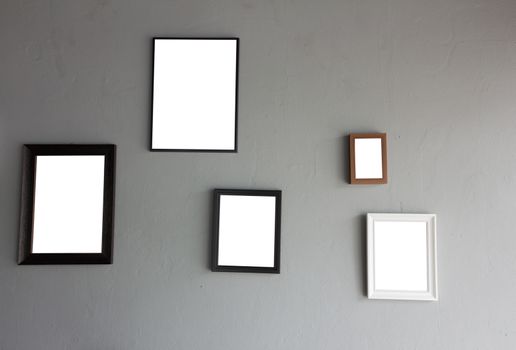 Vintage wooden frame on concrete background.