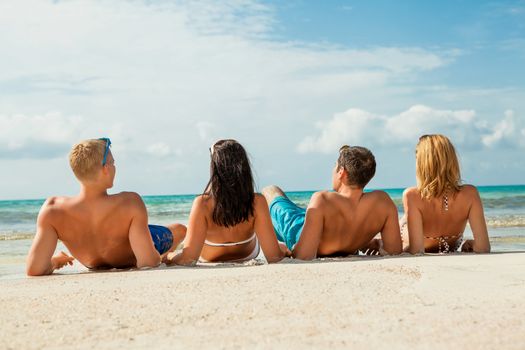 young happy friends havin fun on the beach summer holidays lifestyle