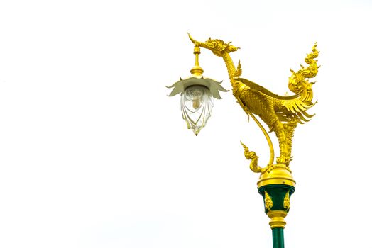 Electric pole with golden thai traditional swan on top isolated on white background