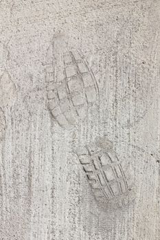 Man footprints on concrete track