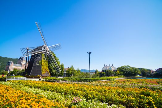 Windmill at Huis Ten Bosch stand in a bright and clear sky, Japan