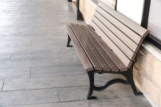 Bench for waiting others shopping in front of the store at outlet mall