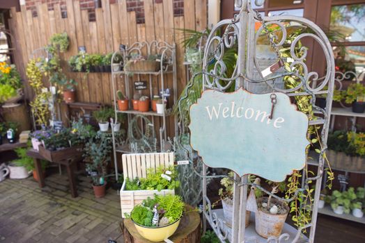 Flower shop with welcome sign and space for additional text