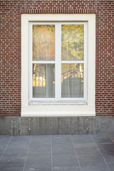 White color vintage style window with brick wall