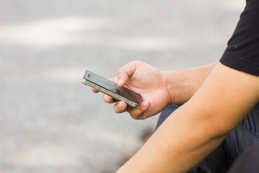 Close up of a man using mobile smart phone, with copyspace