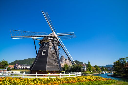 Windmill at Huis Ten Bosch stand in a bright and clear sky, Japan