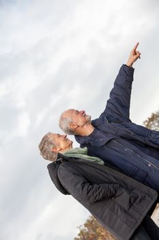 happy senior couple elderly people together outdoor in autumn winter