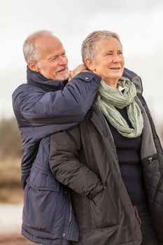 happy senior couple elderly people together outdoor in autumn winter