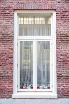 White color vintage style window with brick wall