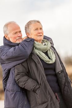 happy senior couple elderly people together outdoor in autumn winter